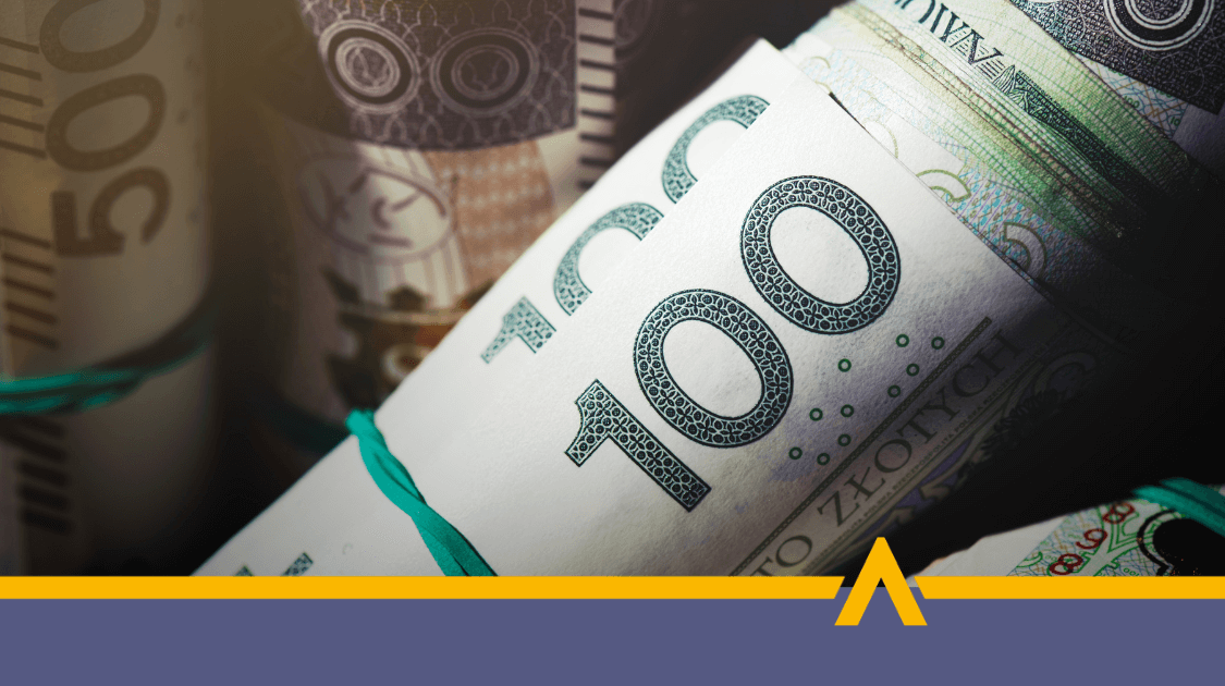 Zwinięte w rulony banknoty 100 i 500 złotych, przewiązane gumkami, symbolizujące gotówkę lub finansowanie